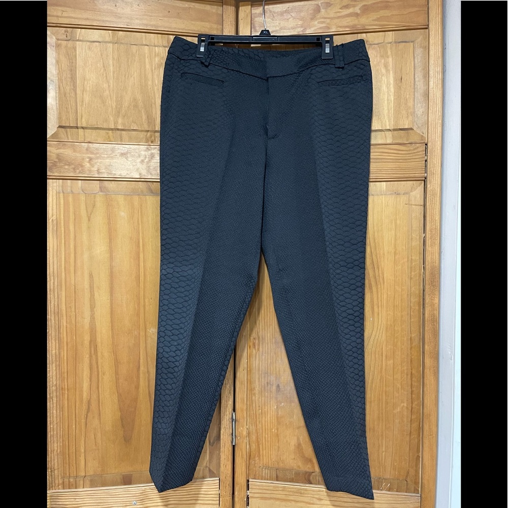 IMAN Women’s snake print dress pants.